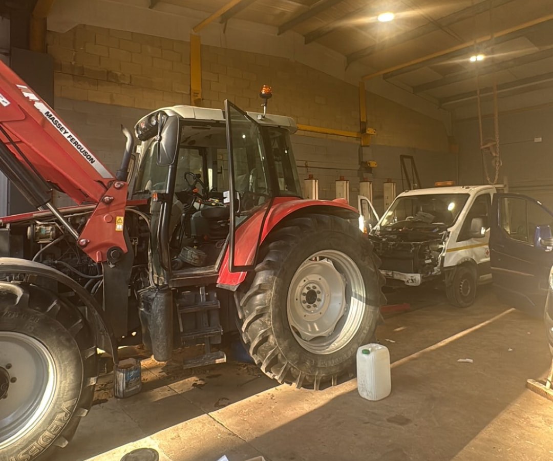 Massey Ferguson tractor being serviced inside the workshop